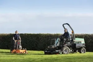 countrywide team posing for photo with ride on mower